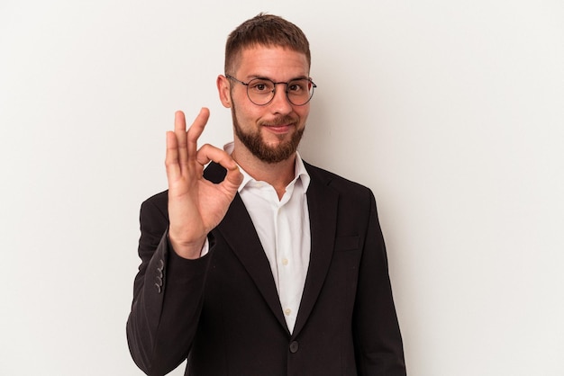 Young business caucasian man isolated on white background cheerful and confident showing ok gesture.