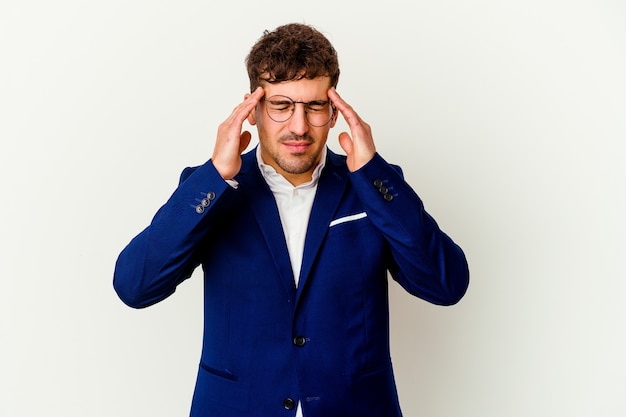 Young business caucasian man isolated on white wall touching temples and having headache