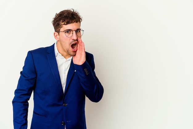 Young business caucasian man on white being shocked because of something she has seen.