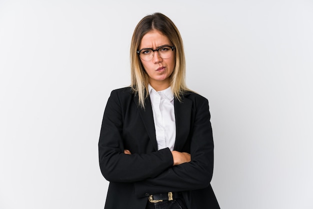 Young business caucasian woman frowning face in displeasure, keeps arms folded.