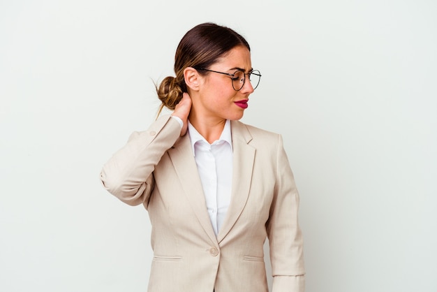 Young business caucasian woman isolated on white background suffering neck pain due to sedentary lifestyle.