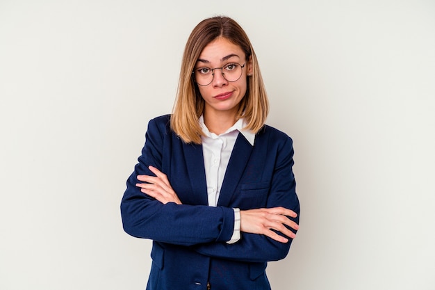 Young business caucasian woman isolated on white background unhappy looking in camera with sarcastic expression.