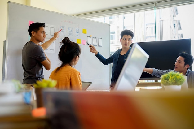 Young business colleagues discussing in office