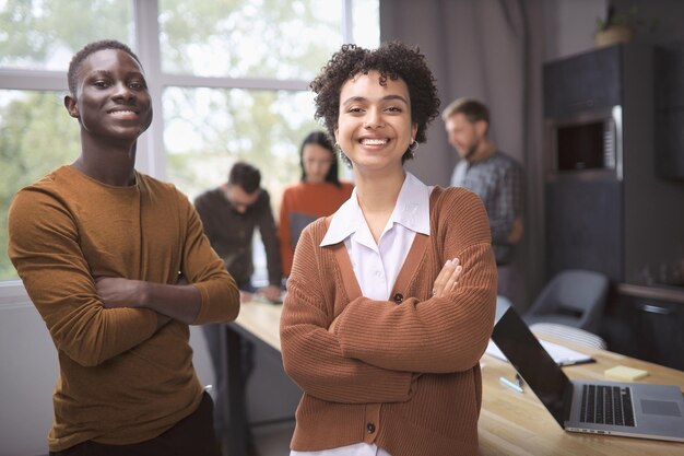 Young business colleagues standing in the hall of the coworking