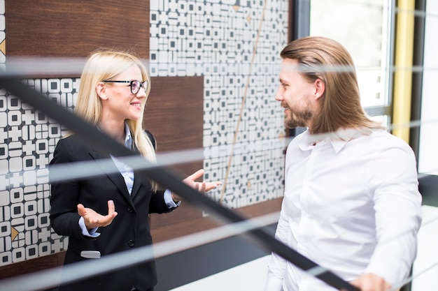 Young business couple in office