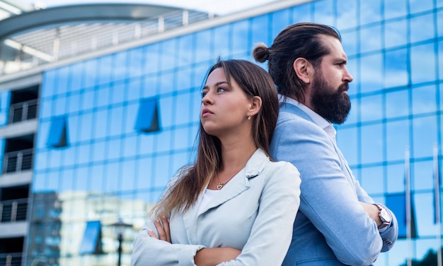 Young business couple outdoor on urban background modern life