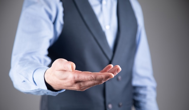 Young business man giving empty hand.