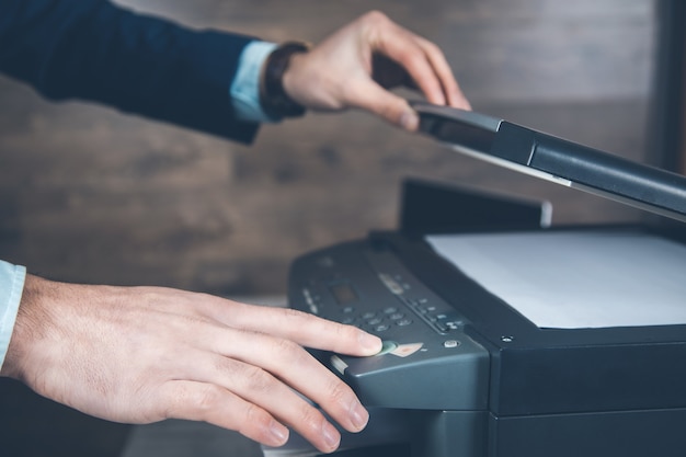 Young business man hand printer