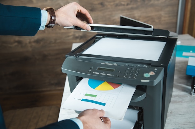 Young business man hand printer