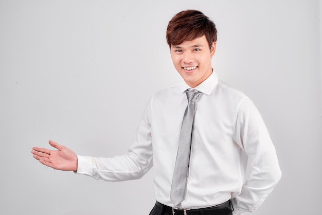 Young business man holding something on his hand