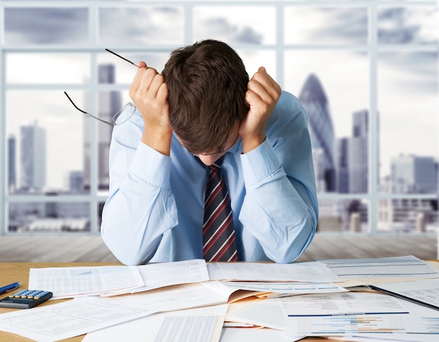 Photo young business man in suit tired from work