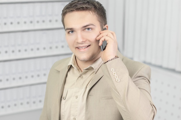 Young business man talking on mobile phone