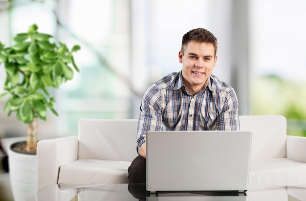 Young business man using laptop for work