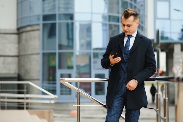 Young business man, wearing stylish classic suit