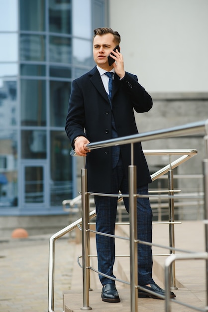 Young business man, wearing stylish classic suit