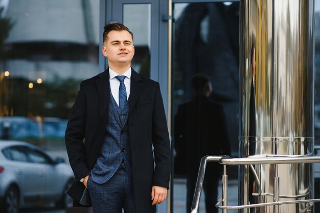 Young business man, wearing stylish classic suit