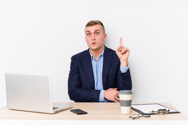 Young business man with a laptop having some great idea, concept of creativity.