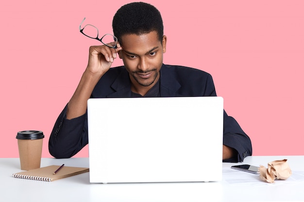 Young business man with laptop