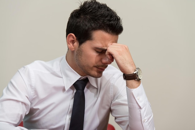 Young Business Man With Problems And Stress In The Office