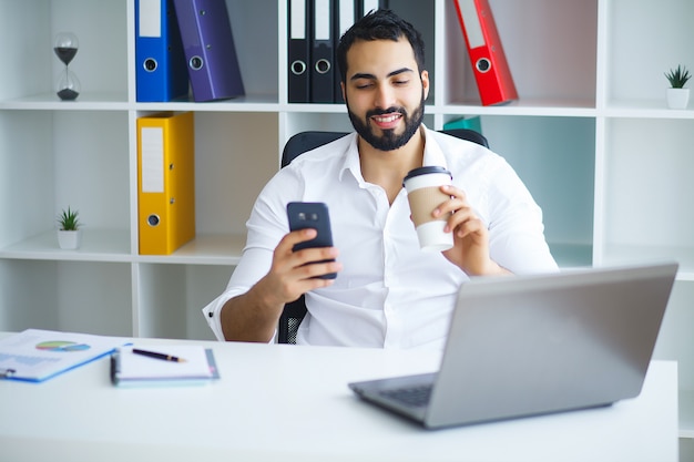 Young Business Man Working On Computer In Office.