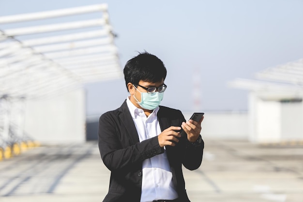 young Business man Working On Laptop and mobile phone