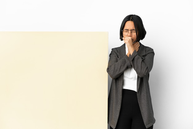 Young business mixed race woman with with a big banner over isolated background coughing a lot