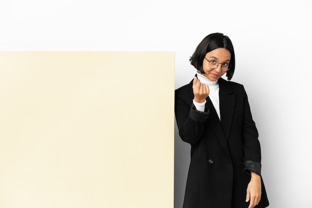 Young business mixed race woman with with a big banner over isolated background making money gesture