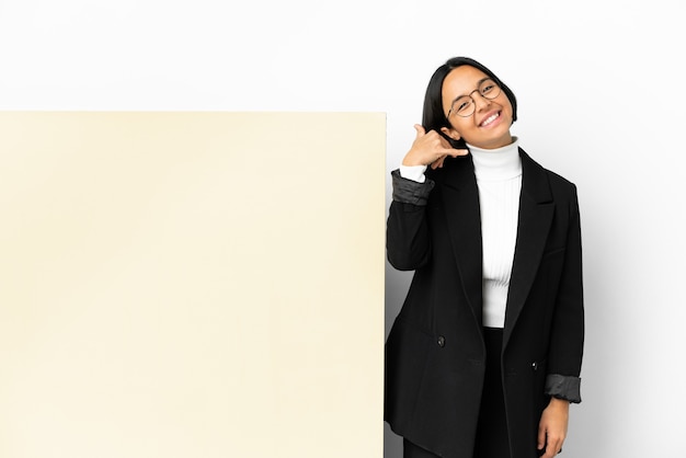 Young business mixed race woman with with a big banner over isolated background making phone gesture. Call me back sign