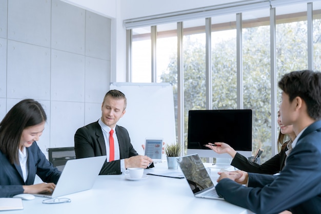 Young business people are presented marketing work project to the customer in meeting room office