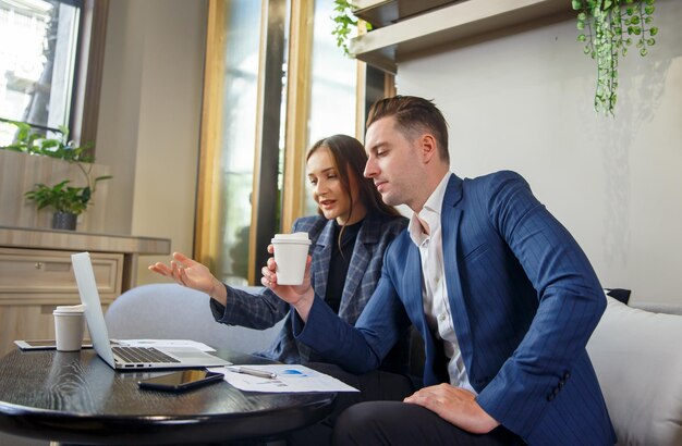 Young business people chatting in start up office