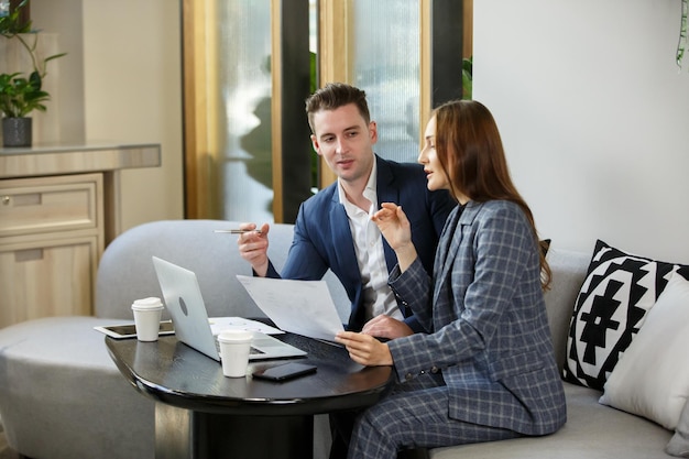 Young business people chatting in start up office