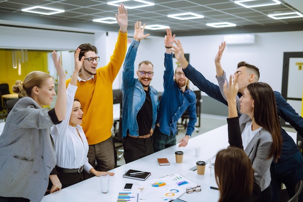 Young business people demonstrating unity with their own
hands