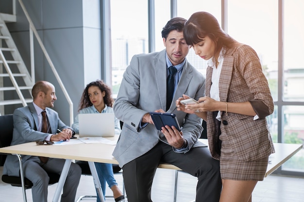 A young business people discussing and brainstorming at modern office