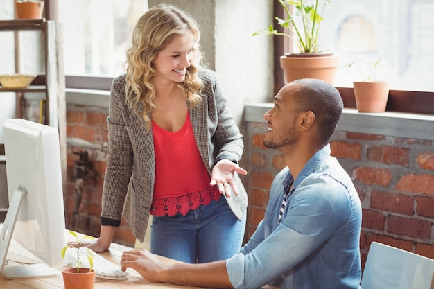 Young business people discussing in office