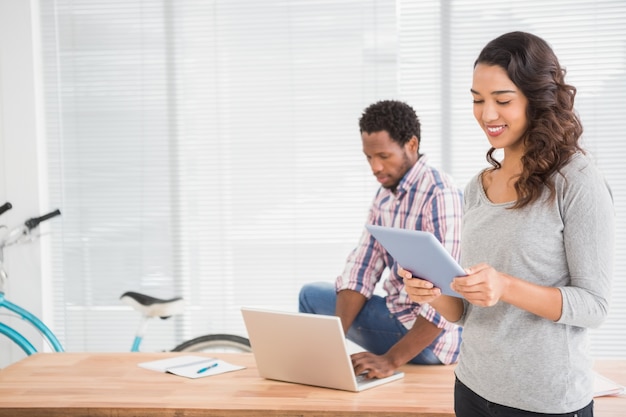 Young business people looking at the laptop