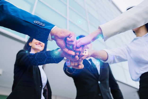 Photo young business people putting their hands together