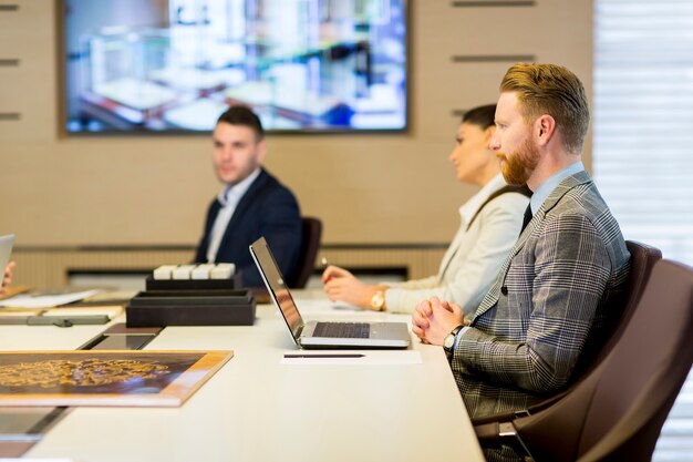 Young business people sitting in the office and working