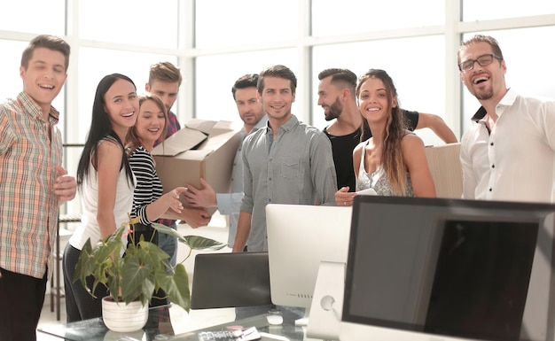 Young business team is unpacking boxes in a new officethe concept of a startup