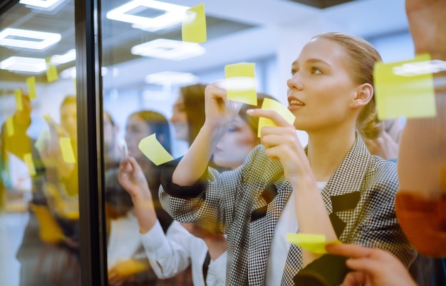 Young business team people brainstorm on corporate project together write strategy tasks