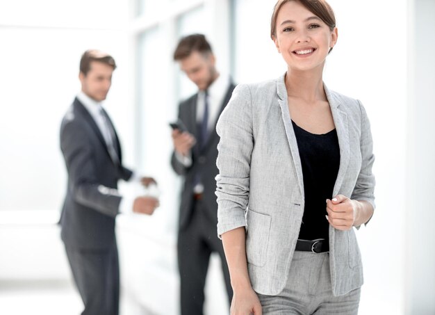 Young business woman on the background of the officephoto with space for text