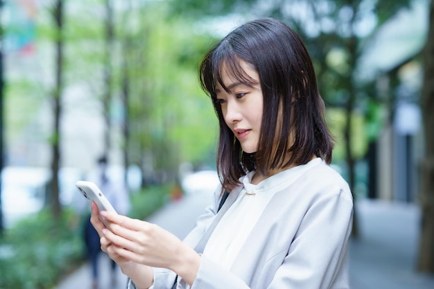 A young business woman calling with an embarrassed look