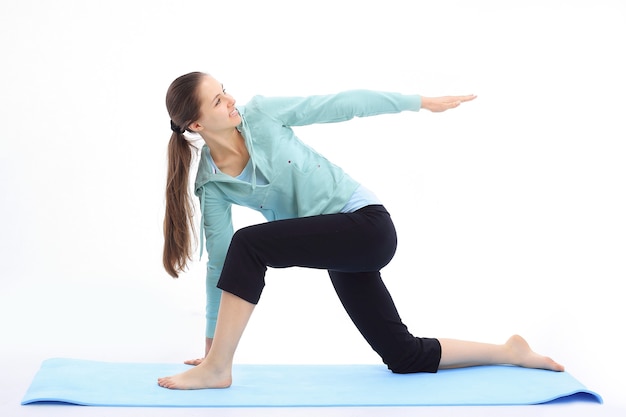 Young business woman doing exercise at the health club.