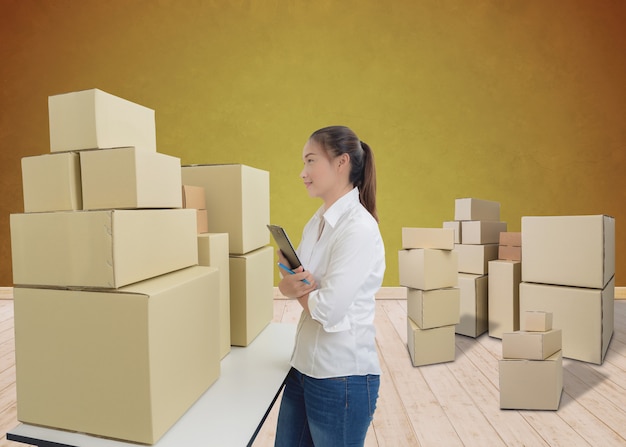 Young business woman, entrepreneur holding a clipboard, check the product