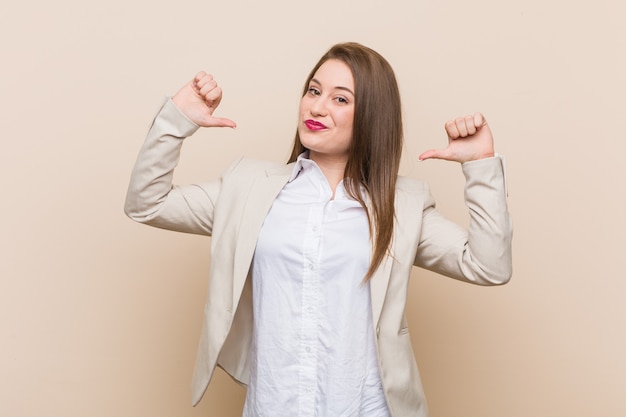 Young business woman feels proud and self confident, example to follow.