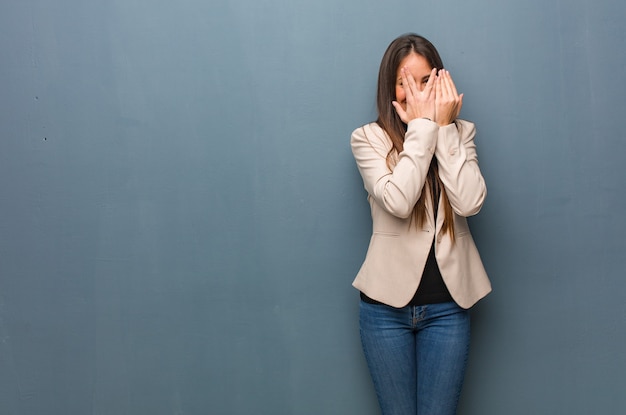 Young business woman feels worried and scared