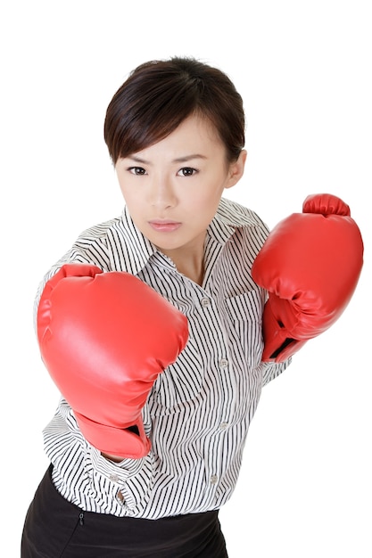 Young business woman fighting, closeup portrait on white wall.