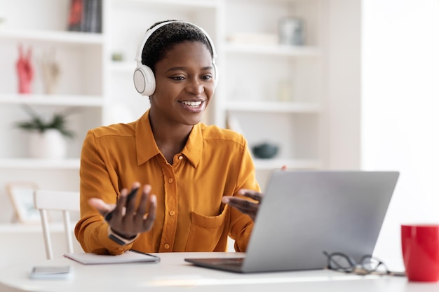 Young business woman having video conference with clients copy space