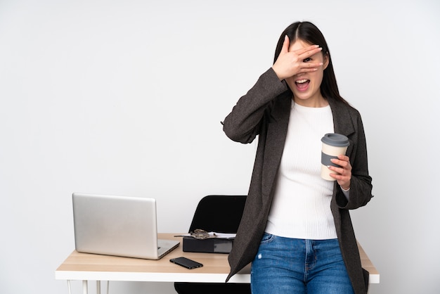 Young business woman in her office