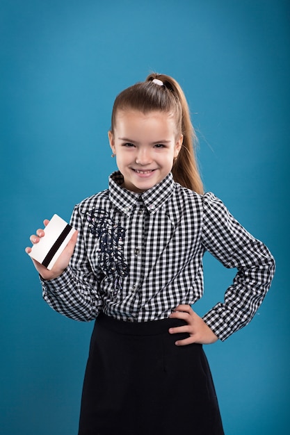 A young business woman holding new credit card