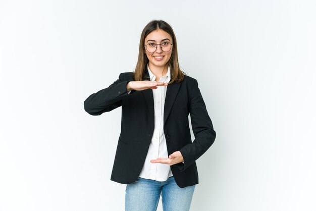 Young business woman holding something with both hands